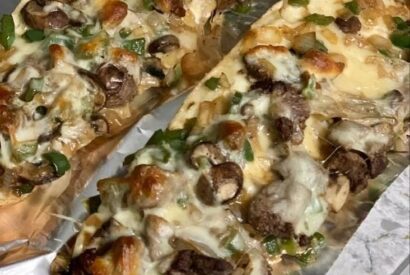 Thumbnail for Philly Cheesesteak Cheesy Bread