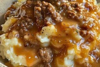 Thumbnail for Mashed potatoes with ground beef gravy