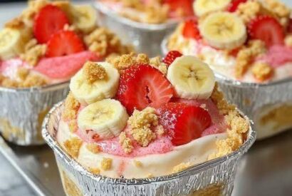 Thumbnail for Strawberry Cheesecake Banana Pudding – creamy banana layers with cheesecake flavor and fresh strawberries.